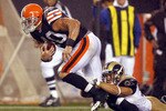 CLEVELAND - AUGUST 21:  Chris Chamberlain #57 of the St. Louis Rams tackles Peyton Hillis #40 of the Cleveland Browns at Cleveland Browns Stadium on August 21, 2010 in Cleveland, Ohio.  (Photo by Matt Sullivan/Getty Images)