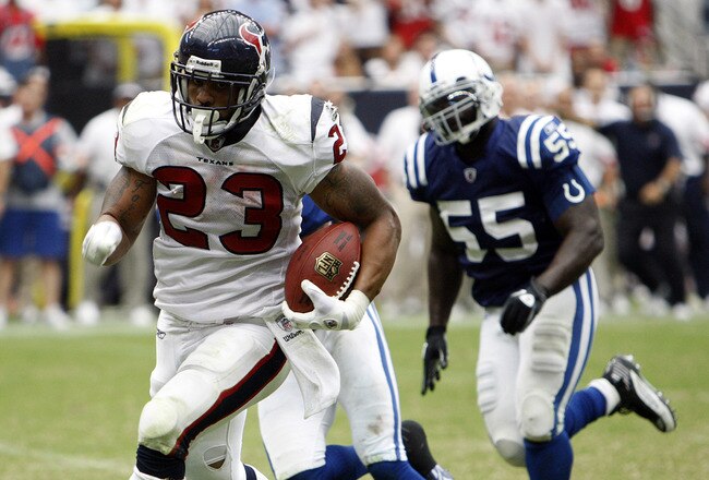HOUSTON - SEPTEMBER 12:  Running back Arian Foster #23 of the Houston Texans rushes past defensive back Antoine Bethea #41 of the Indianapolis Colts during the NFL season opener at Reliant Stadium on September 12, 2010 in Houston, Texas.  (Photo by Bob Levey/Getty Images)