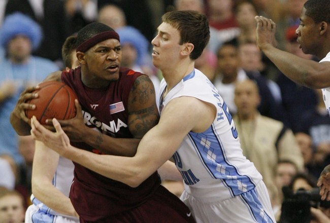 ATLANTA - MARCH 13:  J.T. Thompson #33 of the Virginia Tech Hokies battles for the ball with Tyler Hansbrough #50 of the North Carolina Tar Heels during day two of the 2009 ACC Men's Basketball Tournament on March 13, 2009 at the Georgia Dome in Atlanta, Georgia.  (Photo by Kevin C. Cox/Getty Images)