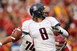 LOS ANGELES, CA - DECEMBER 05:  Quarterback Nick Foles #8 of the Arizona Wildcats throws a pass against the USC Trojans on December 5, 2009 at the Los Angeles Coliseum in Los Angeles, California. Arizona won 21-17.  (Photo by Stephen Dunn/Getty Images)