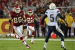 KANSAS CITY, MO - SEPTEMBER 13:  Dexter McCluster #22 of the Kansas City Chiefs returns a punt for a touchdown as punter Mike Scifres #5 of the San Diego Chargers defends during the 1st half of the game against on September 13, 2010 at Arrowhead Stadium in Kansas City, Missouri.  (Photo by Jamie Squire/Getty Images)