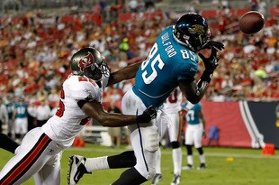TAMPA, FL - AUGUST 28:  Tight end Ernest Wilford #85 of the Jacksonville Jaguars cannot bring in this pass as safety Sean Jones #26 of the Tampa Bay Buccaneers tries to break it up during a preseason game at Raymond James Stadium on August 28, 2010 in Tampa, Florida.  (Photo by J. Meric/Getty Images)