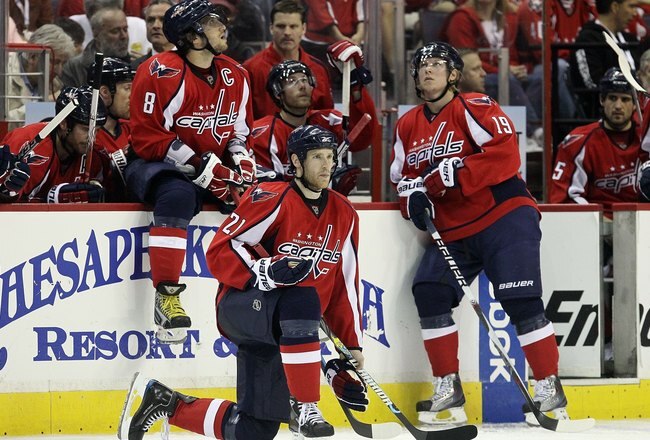 WASHINGTON DC, DC - APRIL 23:  Brooks Laich #21, Alex Ovechkin #8 and Nicklas Backstrom #19 of the Washington Capitals look on against the Montreal Canadiens in Game Five of the Eastern Conference Quarterfinals during the 2010 NHL Stanley Cup Playoffs at the Verizon Center on April 23, 2010 in Washington, DC.  (Photo by Jim McIsaac/Getty Images)