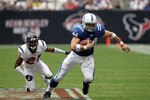 HOUSTON - SEPTEMBER 12:  Tight end Dallas Clark #44 of the Indianapolis Colts runs the ball against Brice McCain #21 of the Houston Texans during the NFL season opener at Reliant Stadium on September 12, 2010 in Houston, Texas.  (Photo by Ronald Martinez/Getty Images)