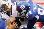 EAST RUTHERFORD, NJ - SEPTEMBER 12:  Matt Moore #3 of the Carolina Panthers is sacked in the fourth quarter by Mathias Kiwanuka #94 of the New York Giants on September 12, 2010 at the New Meadowlands Stadium in East Rutherford, New Jersey. The Giants defeated the Panthers 31-18.  (Photo by Jim McIsaac/Getty Images)