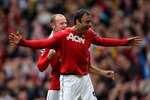 MANCHESTER, ENGLAND - SEPTEMBER 19:  Dimitar Berbatov of Manchester United celebrates scoring his team's second goal with team mate Wayne Rooney during the Barclays Premier League match between Manchester United and Liverpool at Old Trafford on September 19, 2010 in Manchester, England.  (Photo by Alex Livesey/Getty Images)