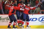 WASHINGTON - APRIL 17: Nicklas Backstrom #19 (R) of the Washington Capitals scores in overtime and is joined by Mike Knuble #22 (L) and Alex Ovechkin #8 (C) to defeat the Montreal Canadiens 6-5  in Game Two of the Eastern Conference Quarterfinals during the 2010 NHL Stanley Cup Playoffs at the Verizon Center on April 17, 2010 in Washington, DC.. (Photo by Bruce Bennett/Getty Images)