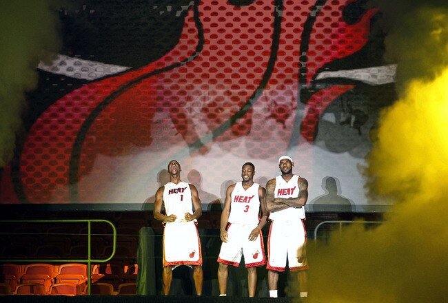 MIAMI - JULY 09:  Fans cheer as (L-R) Chris Bosh #1, Dwyane Wade #3, and LeBron James #6 of the Miami Heat are introduced during a welcome party at American Airlines Arena on July 9, 2010 in Miami, Florida.  (Photo by Marc Serota/Getty Images)