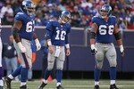 EAST RUTHERFORD, NJ - NOVEMBER 25:  Eli Manning #10 (c) of the New York Giants walks from the field after failing to make a first down against the Minnesota Vikings at Giants Stadium on November 25, 2007 in East Rutherford, New Jersey.  (Photo by Nick Laham/Getty Images)