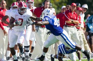 DURHAM, NC - SEPTEMBER 18: Julio Jones #8 of the Alabama Crimson Tide gives a stiff arm to Austin Gamble #45 of the Duke Blue Devils at Wallace Wade Stadium on September 18, 2010 in Durham, North Carolina.  The Crimson Tide defeated the Blue Devils 62-13.  (Photo by Brian A. Westerholt/Getty Images)