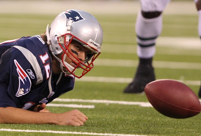 EAST RUTHERFORD, NJ - SEPTEMBER 19: Tom Brady #12 of the New England Patriots loses the ball after being sacked against  the New York Jets during their  game on September 19, 2010 at the New Meadowlands Stadium  in East Rutherford, New Jersey.  (Photo by Al Bello/Getty Images)