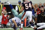 ARLINGTON, TX - SEPTEMBER 19:  Fullback Chris Gronkowski #44 of the Dallas Cowboys flips after a tackle by Zackary Bowman #35 of the Chicago Bears at Cowboys Stadium on September 19, 2010 in Arlington, Texas.  (Photo by Ronald Martinez/Getty Images)
