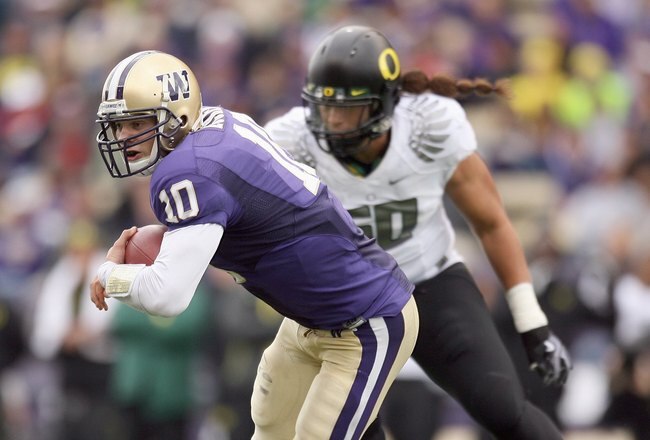 SEATTLE - OCTOBER 24: Quarterback Jake Locker #10 of the Washington Huskies moves with the ball during the game against the Oregon Ducks on October 24, 2009 at Husky Stadium in Seattle, Washington. The Ducks defeated the Huskies 43-19. (Photo by Otto Greule Jr/Getty Images)