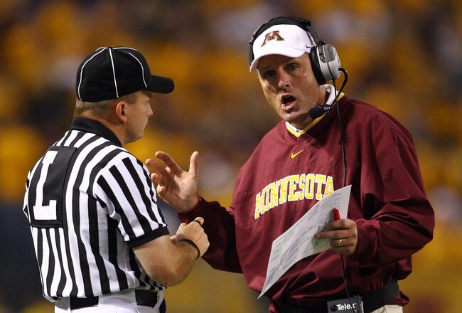 MINNEAPOLIS - SEPTEMBER 13:  Minnesota Golden Gophers' head coach Tim Brewster talks with an official during the game against the Montana State Bobcats at the Metrodome on September 13, 2008 in Minneapolis, Minnesota. Minnesota defeated Montana State 35-23.  (Photo by Jeff Gross/Getty Images)
