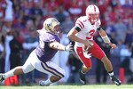 SEATTLE - SEPTEMBER 18: Quarterback Taylor Martinez #3 of the Nebraska Cornhuskers rushes against Sione Potoa'e #55 of the Washington Huskies on September 18, 2010 at Husky Stadium in Seattle, Washington. (Photo by Otto Greule Jr/Getty Images)