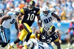 NASHVILLE, TN - SEPTEMBER 19:  Quarterback Dennis Dixon #10 of the Pittsburgh Steelers rolls out under pressure from the Tennessee Titans defense during the first half at LP Field on September 19, 2010 in Nashville, Tennessee.  (Photo by Grant Halverson/Getty Images)