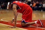 CHICAGO - FEBRUARY 20: Allen Iverson #3 of the Philadelphia 76ers is slow to get up after being hit in the face during a game against the Chicago Bulls at the United Center on February 20, 2010 in Chicago, Illinois. The Bulls defeated the 76ers 122-90. NOTE TO USER: User expressly acknowledges and agrees that, by downloading and/or using this Photograph, User is consenting to the terms and conditions of the Getty Images License Agreement. (Photo by Jonathan Daniel/Getty Images)