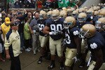 SOUTH BEND, IN - SEPTEMBER 11: Head coach Brian Kelly of the Notre Dame Fighting Irish (L) waits to enter the field with his team before a game against the Michigan Wolverines at Notre Dame Stadium on September 11, 2010 in South Bend, Indiana. Michigan defeated Notre Dame 28-24. (Photo by Jonathan Daniel/Getty Images)