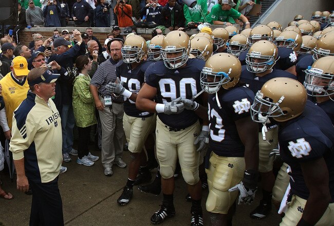 SOUTH BEND, IN - SEPTEMBER 11: Head coach Brian Kelly of the Notre Dame Fighting Irish (L) waits to enter the field with his team before a game against the Michigan Wolverines at Notre Dame Stadium on September 11, 2010 in South Bend, Indiana. Michigan defeated Notre Dame 28-24. (Photo by Jonathan Daniel/Getty Images)