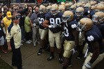 SOUTH BEND, IN - SEPTEMBER 11: Head coach Brian Kelly of the Notre Dame Fighting Irish (L) waits to enter the field with his team before a game against the Michigan Wolverines at Notre Dame Stadium on September 11, 2010 in South Bend, Indiana. Michigan defeated Notre Dame 28-24. (Photo by Jonathan Daniel/Getty Images)
