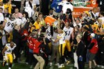 TAMPA, FL - FEBRUARY 01:  James Harrison #92 of the Pittsburgh Steelers pours Gatorade over head coach Mike Tomlin and James Farrior #51 after the Steelers won 27-23 against the Arizona Cardinals during Super Bowl XLIII on February 1, 2009 at Raymond James Stadium in Tampa, Florida.  (Photo by Doug Benc/Getty Images)
