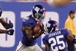 EAST RUTHERFORD, NJ - SEPTEMBER 02:  Antrel Rolle #26 of the New York Giants intercepts a pass intended for Randy Moss #81 of the New England Patriots during the first quarter on September 2, 2010 at the New Meadowlands Stadium in East Rutherford, New Jersey.  (Photo by Jim McIsaac/Getty Images)