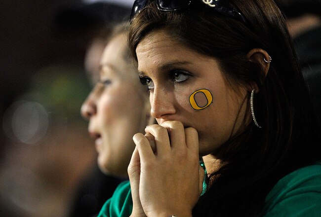 PASADENA, CA - JANUARY 01:  Fans of the Oregon Ducks watch during the final moments of the 96th Rose Bowl game against the Ohio State Buckeyes on January 1, 2010 in Pasadena, California.  (Photo by Kevork Djansezian/Getty Images)