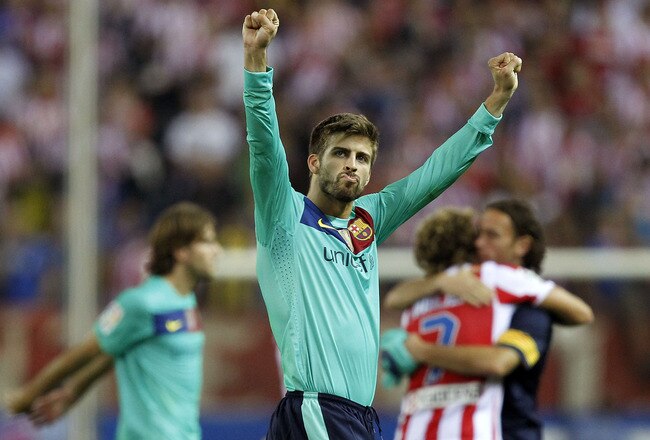 MADRID, SPAIN - SEPTEMBER 19: Gerard Pique of Barcelona celebrates after the La Liga match between Atletico Madrid and Barcelona at Vicente Calderon Stadium on September 19, 2010 in Madrid, Spain. (Photo by Angel Martinez/Getty Images)