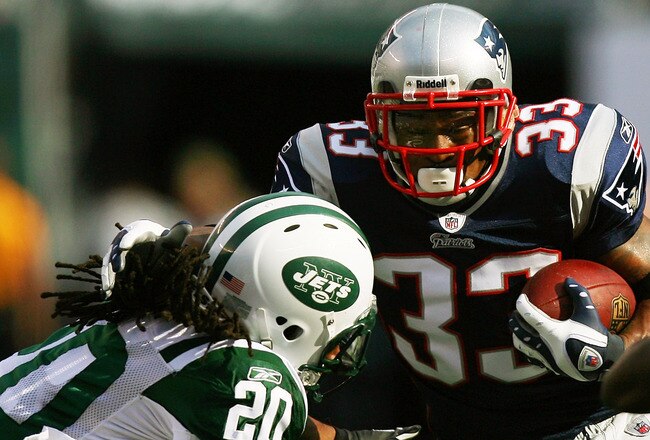 EAST RUTHERFORD, NJ - SEPTEMBER 19:  Kyle Wilson #20 of the New York Jets attempts to tackle Kevin Faulk #33 of the New England Patriots during the first quarter at the New Meadowlands Stadium on September 19, 2010 in East Rutherford, New Jersey.  (Photo by Andrew Burton/Getty Images)
