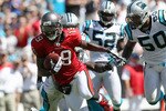 CHARLOTTE, NC - SEPTEMBER 19:  Mike Williams #19 of the Tampa Bay Buccaneers breaks a tackle on his way to scoring a touchdown against the Carolina Panthers during their game at Bank of America Stadium on September 19, 2010 in Charlotte, North Carolina.  (Photo by Streeter Lecka/Getty Images)