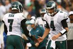 PHILADELPHIA - SEPTEMBER 27: Michael Vick #7 of the Philadelphia Eagles substitutes with team mate Kevin Kolb #4 against the Kansas City Chiefs on September 27, 2009 at Lincoln Financial Field in Philadelphia, Pennsylvania.  (Photo by Chris McGrath/Getty Images)