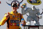 DOVER, DE - MAY 16:  Kyle Busch, driver of the #18 M&M's Toyota, poses in Victory Lane after winning the NASCAR Sprint Cup Series Autism Speaks 400 at Dover International Speedway on May 16, 2010 in Dover, Delaware.  (Photo by Jason Smith/Getty Images for NASCAR)