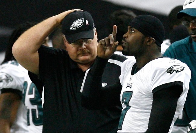 ATLANTA - DECEMBER 06:  Head coach Andy Reid and Michael Vick #7 of the Philadelphia Eagles walks out on the field to face the Atlanta Falcons at Georgia Dome on December 6, 2009 in Atlanta, Georgia.  (Photo by Kevin C. Cox/Getty Images)