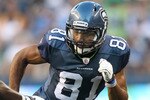 SEATTLE - AUGUST 14:  Wide receiver Golden Tate #81 of the Seattle Seahawks rushes during the preseason game against Jason McCourty #30 of the Tennessee Titans at Qwest Field on August 14, 2010 in Seattle, Washington. (Photo by Otto Greule Jr/Getty Images)