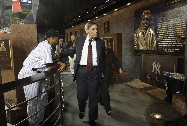 NEW YORK - SEPTEMBER 20:  Baseball commissioner Bud Selig, (C) reaches out to New York Yankees closer Mariano Rivera following a ceremony dedicating a monument to the late Yankees principal owner George Steinbrenner before the Yankees baseball game against the Tampa Bay Rays on September 20, 2010 at Yankee Stadium in the Bronx borough of New York City. (Photo by Kathy Willens-Pool/Getty Images)