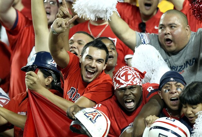 TUCSON, AZ - SEPTEMBER 18:  Fans of the Arizona Wildcats cheer during the college football game against the Iowa Hawkeyes at Arizona Stadium on September 18, 2010 in Tucson, Arizona.  (Photo by Christian Petersen/Getty Images)