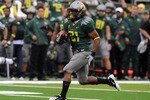 EUGENE, OR - SEPTEMBER 18: Running back LaMichael James #21of the Oregon Ducks heads to the end zone for a touchdown in the first quarter of the game against the Portland State Vikings at Autzen Stadium on September 18, 2010 in Eugene, Oregon. Oregon won the game 69-0.  (Photo by Steve Dykes/Getty Images)