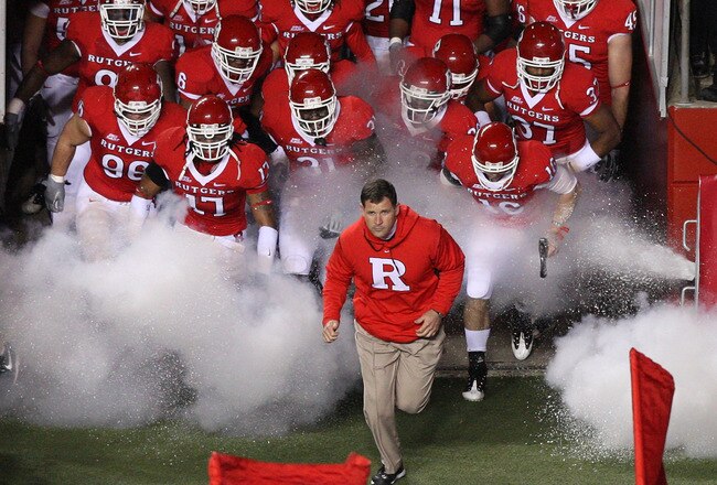 PISCATAWAY, NJ - NOVEMBER 12:  Head coach Greg Schiano of the Rutgers Scarlet Knights leads his team on the field to play against the South Florida Bulls at Rutgers Stadium on November 12, 2009 in Piscataway, New Jersey.  (Photo by Jim McIsaac/Getty Images)