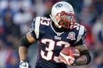 FOXBORO, MA - JANUARY 10:  Kevin Faulk #33 of the New England Patriots runs the ball against the Baltimore Ravens during the 2010 AFC wild-card playoff game at Gillette Stadium on January 10, 2010 in Foxboro, Massachusetts.  (Photo by Elsa/Getty Images)