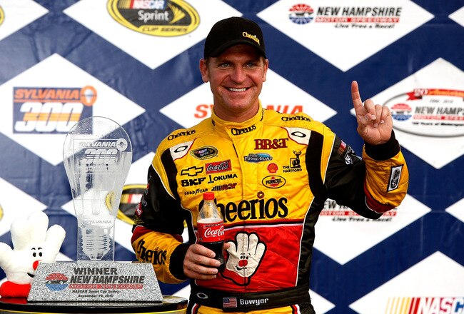 LOUDON, NH - SEPTEMBER 19:  Clint Bowyer, driver of the #33 Cheerios / Hamburger Helper Chevrolet, is sprayed with champagne and beer as he celebrates with his crew in victory lane after Bowyer won the NASCAR Sprint Cup Series Sylvania 300 at New Hampshire Motor Speedway on September 19, 2010 in Loudon, New Hampshire.  (Photo by Jerry Markland/Getty Images for NASCAR)