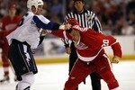 TAMPA, FL - SEPTEMBER 24: Andre Roy #36 of the Tampa Bay Lightning tangles with Aaron Downey #20 of the Detroit Red Wings during a NHL pre-season game at the St. Pete Times Forum on September 24, 2007 in Tampa, Florida. (Photo by Eliot J. Schechter/Getty Images)