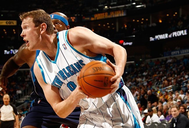 NEW ORLEANS - MARCH 22:  Darius Songaila #9 of the New Orleans Hornets drives the ball during the game against the Dallas Mavericks at the New Orleans Arena on March 22, 2010 in New Orleans, Louisiana.  NOTE TO USER: User expressly acknowledges and agrees that, by downloading and/or using this Photograph, User is consenting to the terms and conditions of the Getty Images License Agreement.  (Photo by Chris Graythen/Getty Images)