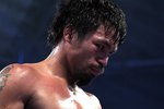 ARLINGTON, TX - MARCH 13:  Manny Pacquiao of the Philippines looks on in the ring against Joshua Clottey of Ghana during the WBO welterweight title fight at Cowboys Stadium on March 13, 2010 in Arlington, Texas. Pacquiao defeated Clottey by unanimous decision.  (Photo by Jed Jacobsohn/Getty Images)