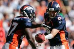 DENVER - SEPTEMBER 19: Quarterback Kyle Orton #8 of the Denver Broncos hands the ball off to running back Knowshon Moreno #27 during an NFL game against the Seattle Seahawks at INVESCO Field at Mile High on September 19, 2010 in Denver, Colorado.  (Photo by Justin Edmonds/Getty Images)