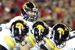 TUCSON, AZ - SEPTEMBER 18:  Quarterback Ricky Stanzi #12 of the Iowa Hawkeyes prepares to snap the ball during the college football game against the Arizona Wildcats at Arizona Stadium on September 18, 2010 in Tucson, Arizona.  The Wildcats defeated the Hawkeyes 34-27.  (Photo by Christian Petersen/Getty Images)