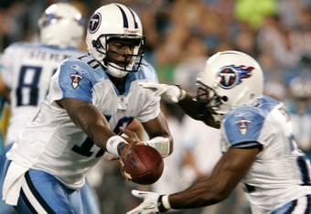 CHARLOTTE, NC - AUGUST 28:  Quarterback Vince Young #10 of the Tennessee Titans hands off the ball to his running back Jonathan Stewart #28 during their preseason game against the Carolina Panthers at Bank of America Stadium on August 28, 2010 in Charlotte, North Carolina. (Photo by Mary Ann Chastain/Getty Images)