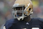 SOUTH BEND, IN - SEPTEMBER 11: Kapron Lewis-Moore #89 of the Notre Dame Fighting Irish looks to bench for instructions against the Michigan Wolverines at Notre Dame Stadium on September 11, 2010 in South Bend, Indiana. Michigan defeated Notre Dame 28-24. (Photo by Jonathan Daniel/Getty Images)