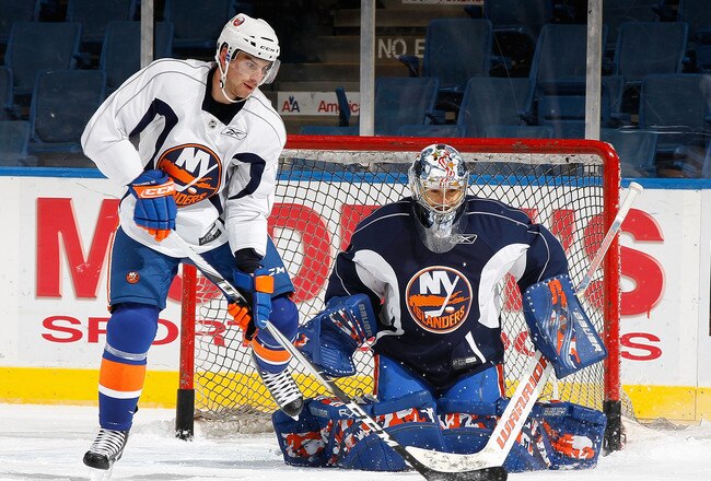 UNIONDALE, NY - SEPTEMBER 21:  John Tavares #91 of the New York Islanders is denied by goaltender Rick DiPietro #39 during a training camp session on September 21, 2010 at Nassau Coliseum in Uniondale.  (Photo by Mike Stobe/Getty Images)