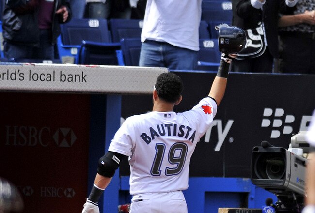 TORONTO - SEPTEMBER 23:   Jose Bautista #19 of the Toronto Blue Jays tips his hat to the crowd after hitting his 50th home run of the season during game action against the Seattle Mariners September 23, 2010 at Rogers Centre in Toronto, Ontario, Canada. (Photo by Brad White/Getty Images)