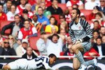 LONDON, ENGLAND - SEPTEMBER 25:  Manuel Almunia of Arsenal looks dejected as he fouls Peter Odemwingie of West Bromwich Albion for a penalty during the Barclays Premier League match between Arsenal and West Bromwich Albion at the Emirates Stadium on September 25, 2010 in London, England.  (Photo by Julian Finney/Getty Images)